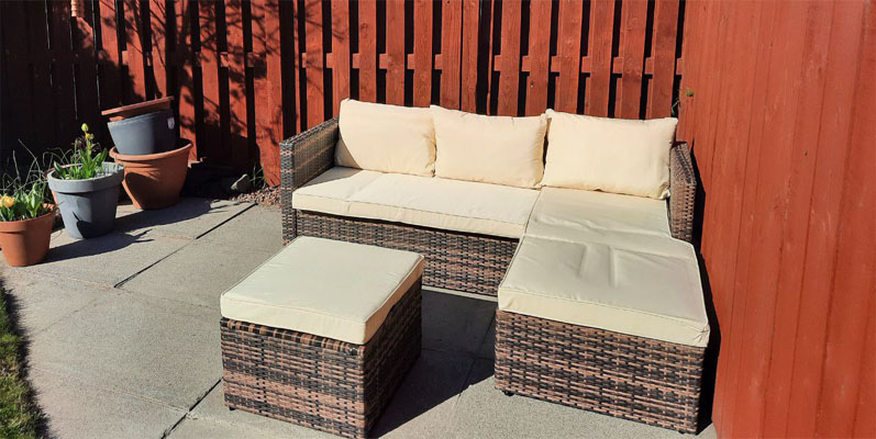 A garden sofa and stool combination which can be arranged in different ways. This rattan garden sofa set offers a lot of flexibility and comes with six cushions. Garden furniture assembly by Flat Pack Happy.