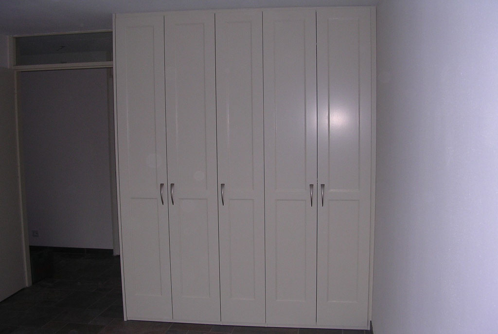 A wardrobe with five doors. Behind the doors you find shelf storage as well as hanging rails. Assembled by Flat Pack Happy.