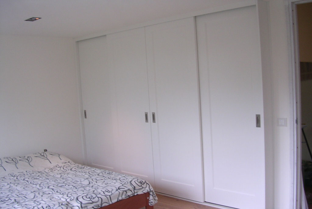 Sliding door wardrobe with 4 sliding doors. Assembled by Flat Pack Happy.